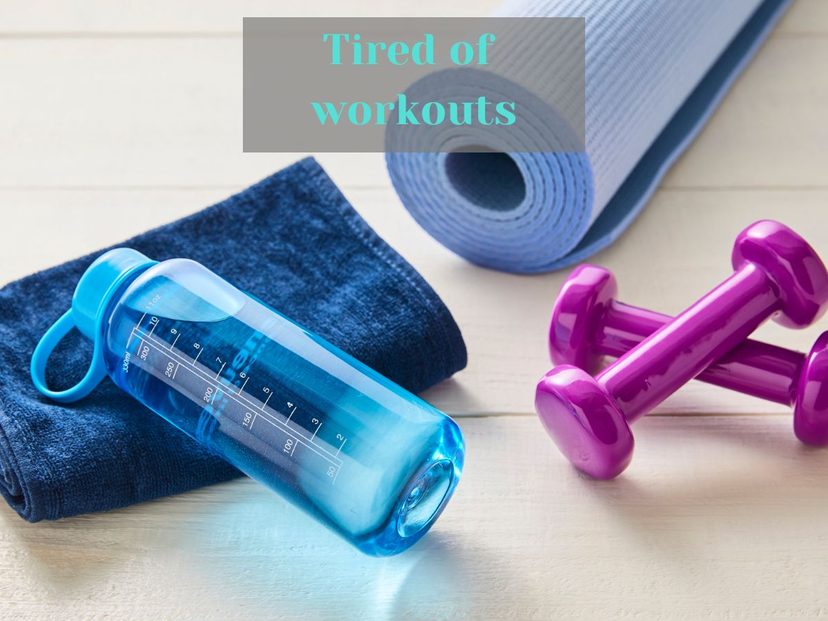 weights, a yoga mat, and a water bottle and sweat towel