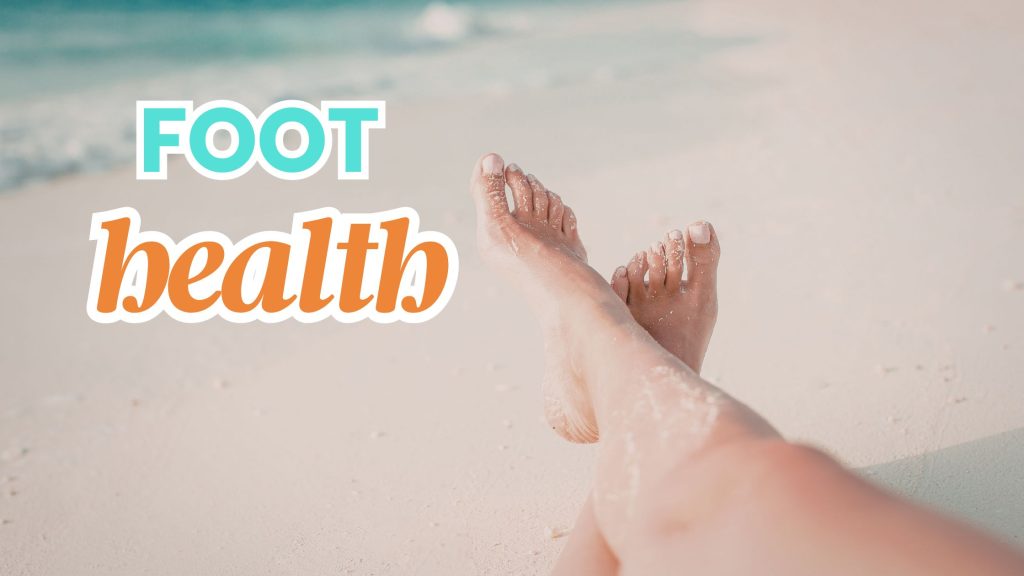 person sitting barefoot on the beach, only her legs are showing