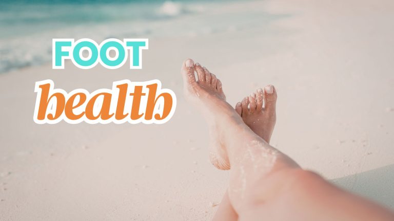 person sitting barefoot on the beach, only her legs are showing