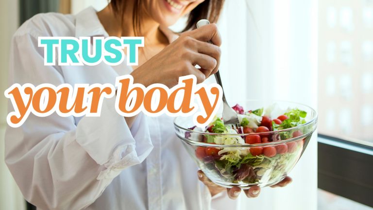 a woman eating a big salad